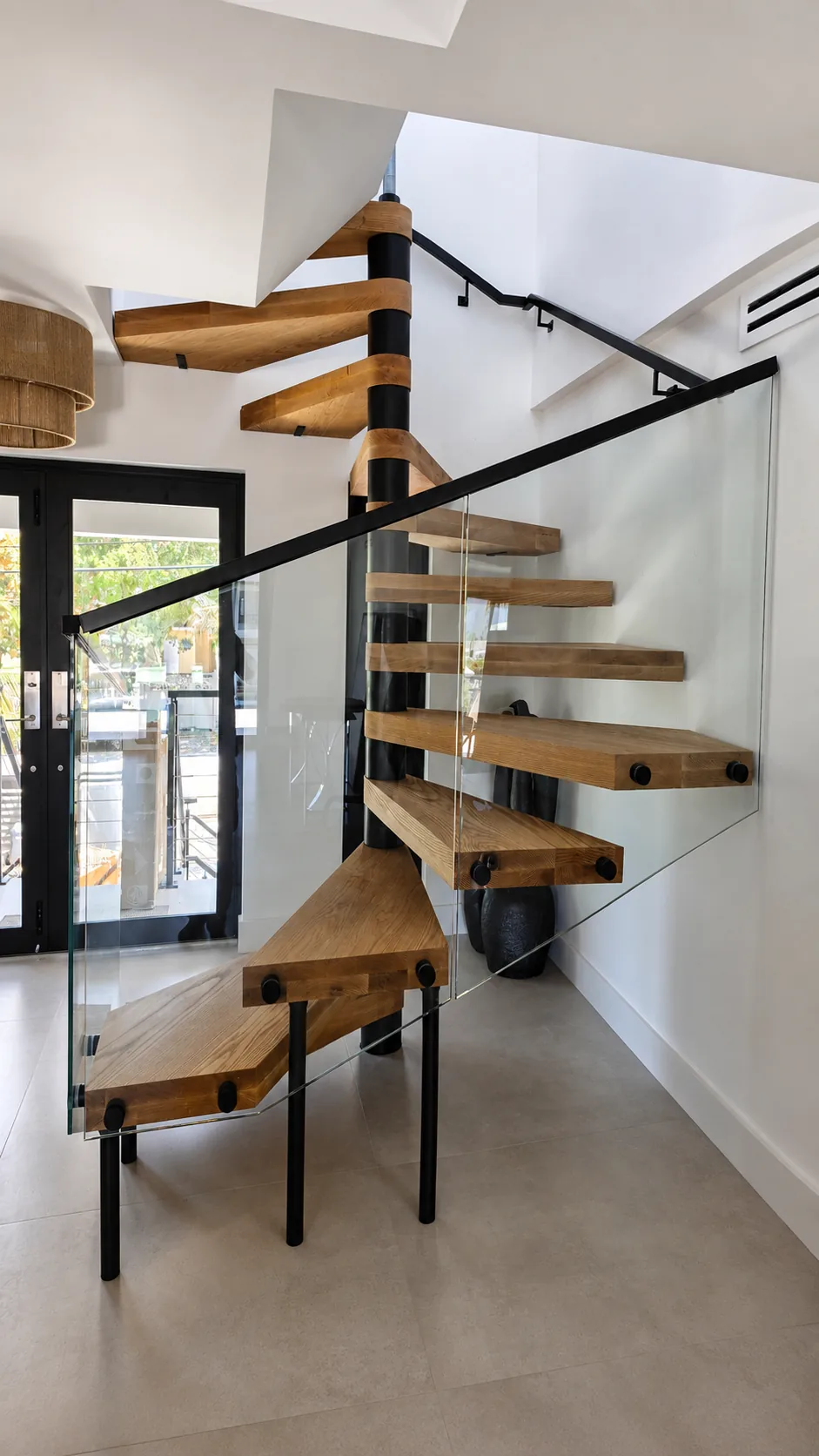Interior wood and glass spiral staircase