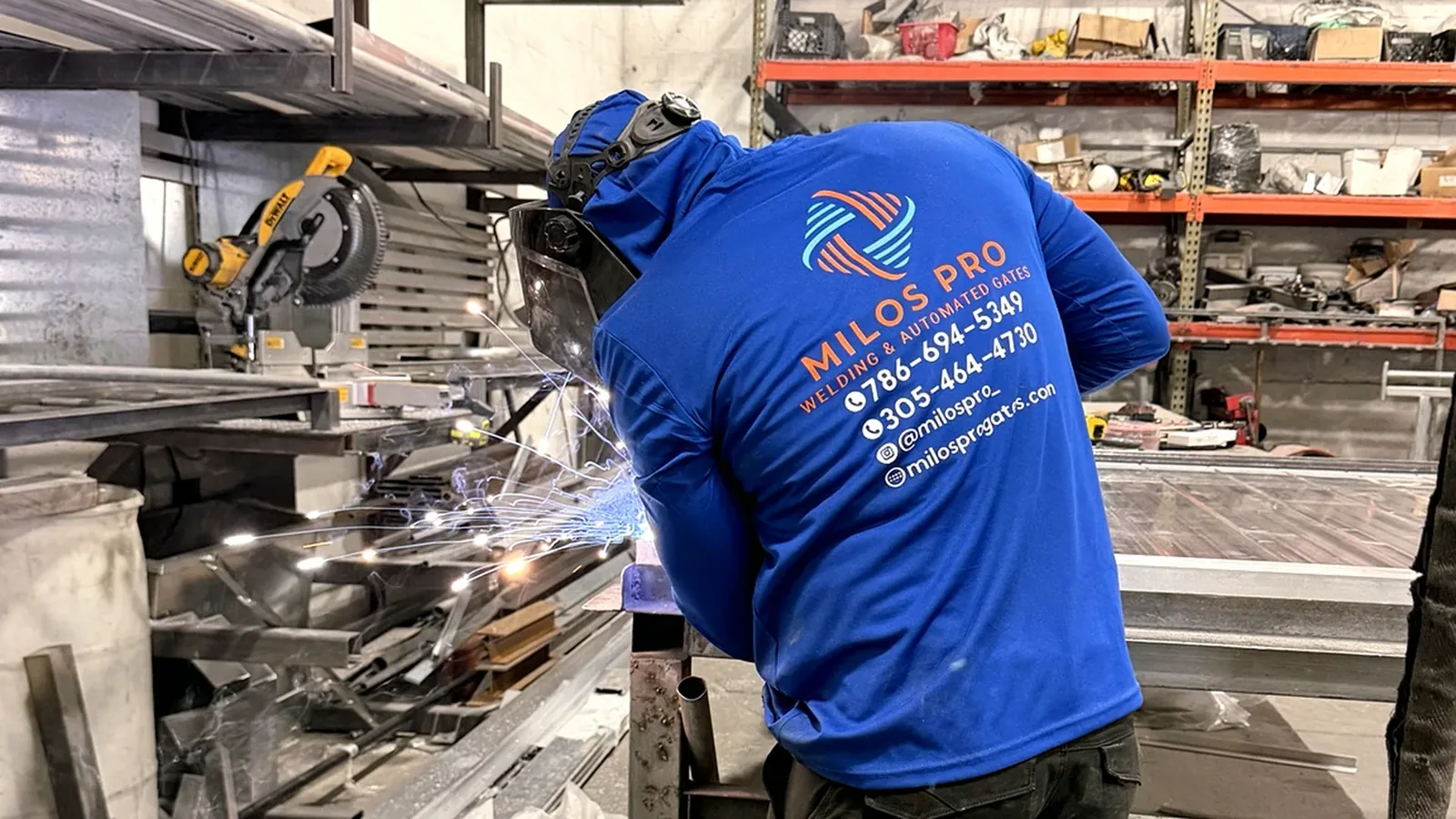 Milos Pro welder fabricating a custom gate in the workshop